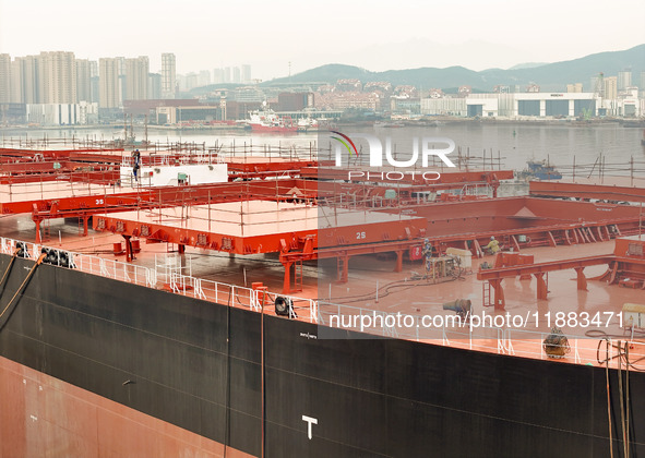 A large ship is about to be delivered at China State Shipbuilding Corporation Qingdao Beihai Shipbuilding Co LTD in Qingdao, China, on Decem...