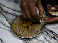 Harissa is prepared and served to customers on a cold winter day in Srinagar, Jammu and Kashmir, India, on December 20, 2024. This tradition...