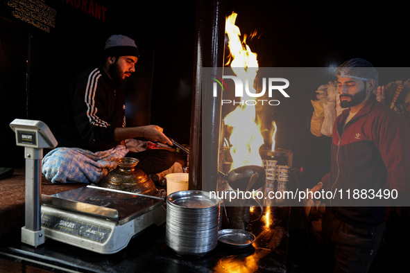 Harissa is prepared and served to customers on a cold winter day in Srinagar, Jammu and Kashmir, India, on December 20, 2024. This tradition...