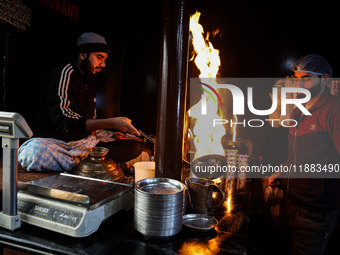 Harissa is prepared and served to customers on a cold winter day in Srinagar, Jammu and Kashmir, India, on December 20, 2024. This tradition...