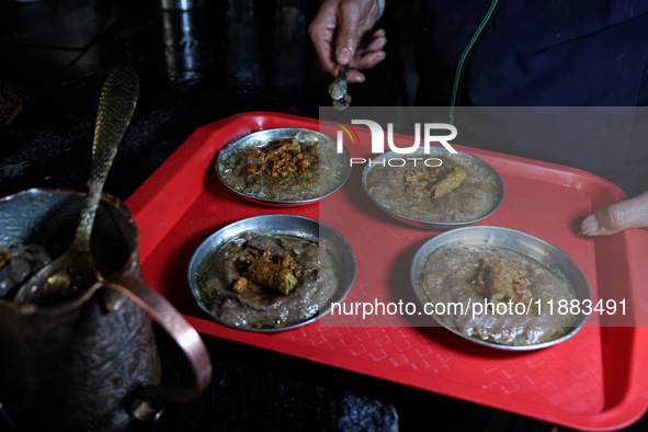 Harissa is prepared and served to customers on a cold winter day in Srinagar, Jammu and Kashmir, India, on December 20, 2024. This tradition...