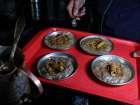 Harissa is prepared and served to customers on a cold winter day in Srinagar, Jammu and Kashmir, India, on December 20, 2024. This tradition...