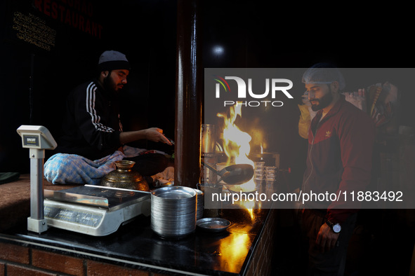 Harissa is prepared and served to customers on a cold winter day in Srinagar, Jammu and Kashmir, India, on December 20, 2024. This tradition...