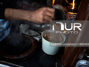 Harissa is prepared and served to customers on a cold winter day in Srinagar, Jammu and Kashmir, India, on December 20, 2024. This tradition...