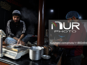 Harissa is prepared and served to customers on a cold winter day in Srinagar, Jammu and Kashmir, India, on December 20, 2024. This tradition...