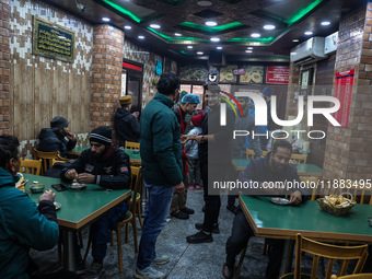 Harissa is prepared and served to customers on a cold winter day in Srinagar, Jammu and Kashmir, India, on December 20, 2024. This tradition...