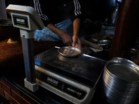 Harissa is prepared and served to customers on a cold winter day in Srinagar, Jammu and Kashmir, India, on December 20, 2024. This tradition...