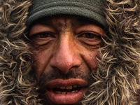 A Kashmiri wears warm clothing on a cold winter morning in Srinagar, Jammu and Kashmir, India, on December 20, 2024. (