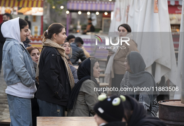 Iranian women visit the Abasabad tourism zone in central Tehran, Iran, on December 19, 2024. 