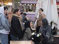 Iranian women visit the Abasabad tourism zone in central Tehran, Iran, on December 19, 2024. (