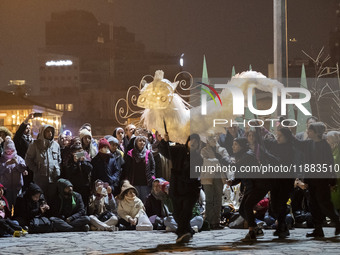 Young Iranian puppeteers perform in a festival in the Abasabad tourism zone in central Tehran, Iran, on December 19, 2024. (