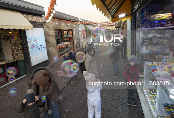 Iranian families visit the Abasabad tourism zone in central Tehran, Iran, on December 19, 2024. 