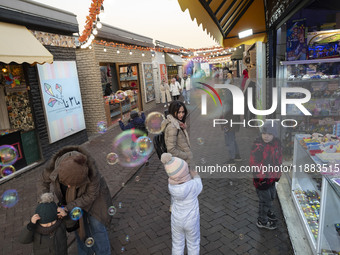 Iranian families visit the Abasabad tourism zone in central Tehran, Iran, on December 19, 2024. (