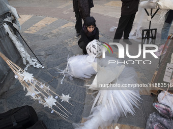 A young Iranian female puppeteer prepares to perform at a festival in the Abasabad tourism zone in central Tehran, Iran, on December 19, 202...