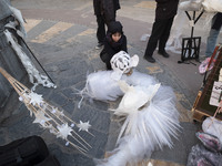 A young Iranian female puppeteer prepares to perform at a festival in the Abasabad tourism zone in central Tehran, Iran, on December 19, 202...