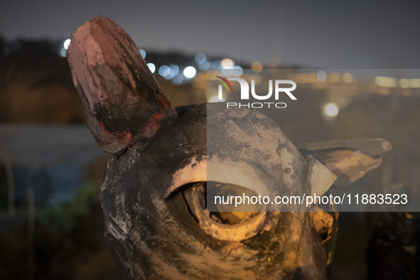 A young Iranian puppeteer wears a mouse-shaped mask and waits to perform at a festival in the Abasabad tourism zone in central Tehran, Iran,...