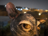 A young Iranian puppeteer wears a mouse-shaped mask and waits to perform at a festival in the Abasabad tourism zone in central Tehran, Iran,...