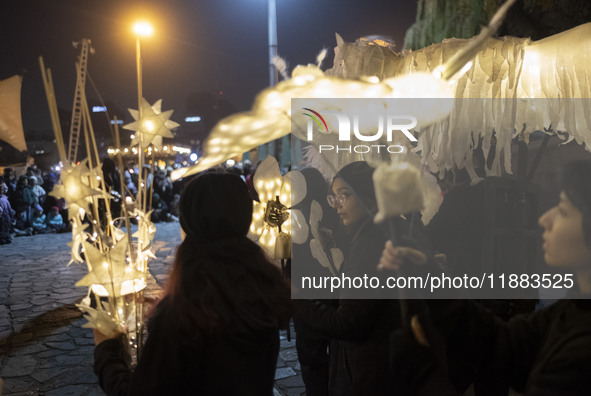 Young Iranian female puppeteers stand with their puppets and perform at a festival in the Abasabad tourism zone in central Tehran, Iran, on...