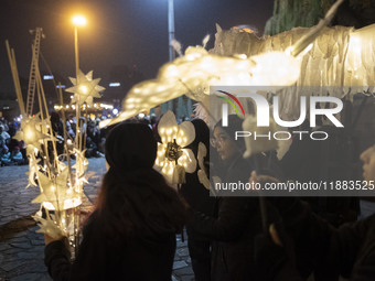 Young Iranian female puppeteers stand with their puppets and perform at a festival in the Abasabad tourism zone in central Tehran, Iran, on...