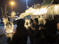 Young Iranian female puppeteers stand with their puppets and perform at a festival in the Abasabad tourism zone in central Tehran, Iran, on...