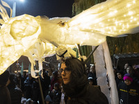 A young Iranian female puppeteer stands with her puppet and performs at a festival in the Abasabad tourism zone in central Tehran, Iran, on...