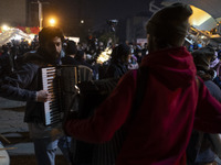 Young Iranian artists play music while performing at a festival in the Abasabad tourism zone in central Tehran, Iran, on December 19, 2024....