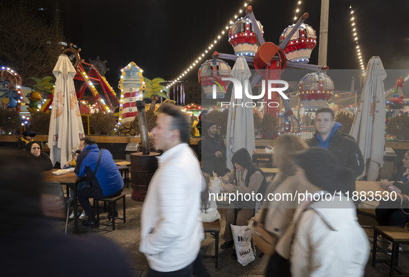 Iranian families visit the Abasabad tourism zone in central Tehran, Iran, on December 19, 2024. 