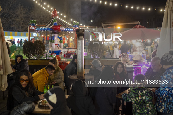 Iranian families visit the Abasabad tourism zone in central Tehran, Iran, on December 19, 2024. 