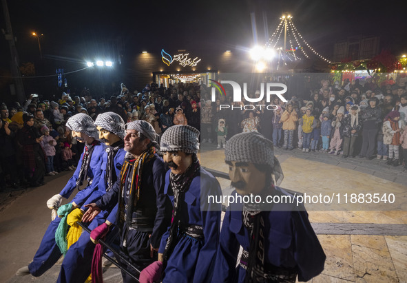 An Iranian Kurd puppeteer performs a traditional Kurdish dance with puppets during a festival in the Abasabad tourism zone in central Tehran...