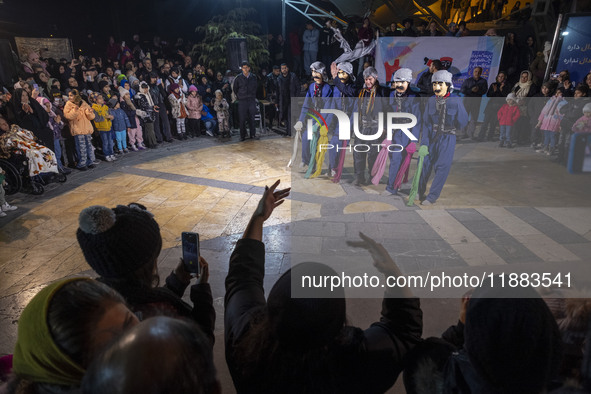 An Iranian Kurd puppeteer performs a traditional Kurdish dance with puppets during a festival in the Abasabad tourism zone in central Tehran...