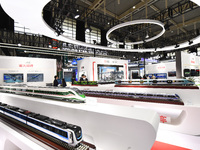 People visit a model EMU train on display at the World Intelligent Manufacturing Conference 2024 in Nanjing, China, on December 20, 2024. (