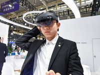 People experience Huawei intelligent equipment at the 2024 World Intelligent Manufacturing Conference in Nanjing, China, on December 20, 202...