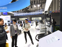 People visit and exhibit smart products at the 2024 World Intelligent Manufacturing Conference in Nanjing, China, on December 20, 2024. (