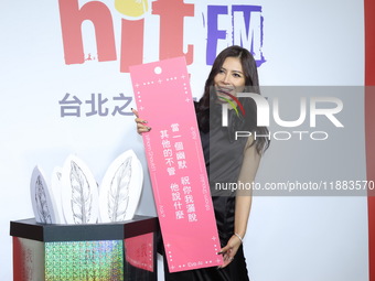 Taiwanese female singer Eve Ai attends a radio event to promote her new album in Taipei, Taiwan, on December 20, 2024. (