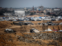 A picture shows a makeshift tent camp for displaced Palestinians in rainy weather in Khan Yunis, Gaza Strip, on December 20, 2024, amid the...