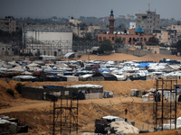 A picture shows a makeshift tent camp for displaced Palestinians in rainy weather in Khan Yunis, Gaza Strip, on December 20, 2024, amid the...