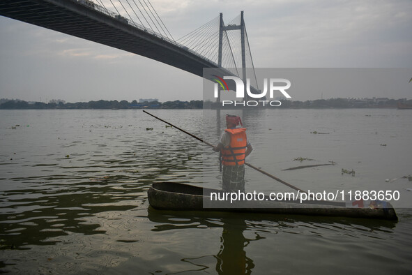 A boat made out of a palm tree is displayed during the annual boat festival in Kolkata, India, on December 20, 2024. 