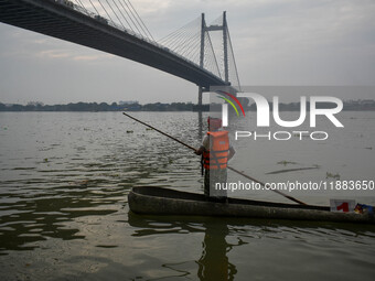 A boat made out of a palm tree is displayed during the annual boat festival in Kolkata, India, on December 20, 2024. (