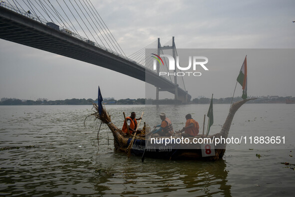 A boat made out of straws derived from the southern cattail plant is displayed during the annual boat festival in Kolkata, India, on Decembe...