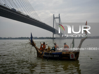 A boat made out of straws derived from the southern cattail plant is displayed during the annual boat festival in Kolkata, India, on Decembe...