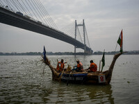 A boat made out of straws derived from the southern cattail plant is displayed during the annual boat festival in Kolkata, India, on Decembe...