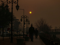 The sun sets on a cold winter evening in Srinagar, Jammu and Kashmir, on December 20, 2024. Kashmir remains in the grip of a cold wave, with...