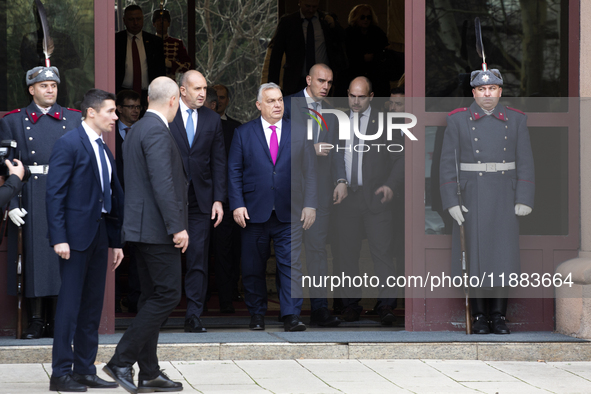 Hungarian Prime Minister Victor Orban (on the right) and President of Bulgaria Rumen Radev stand in front of the Presidency building in Sofi...