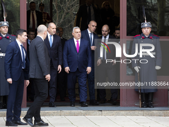 Hungarian Prime Minister Victor Orban (on the right) and President of Bulgaria Rumen Radev stand in front of the Presidency building in Sofi...