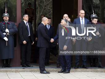 Hungarian Prime Minister Victor Orban (on the right) and President of Bulgaria Rumen Radev stand in front of the Presidency building in Sofi...