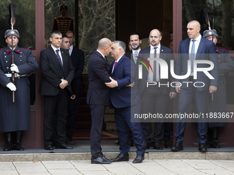 Hungarian Prime Minister Victor Orban (on the right) and President of Bulgaria Rumen Radev stand in front of the Presidency building in Sofi...