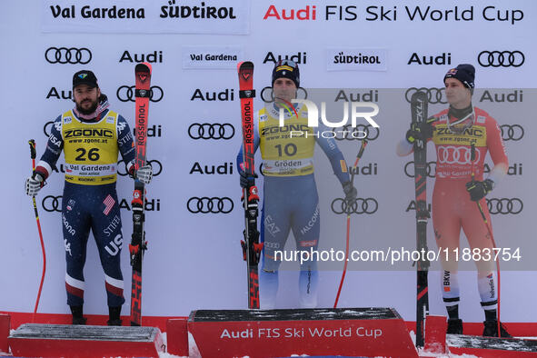 (From left to right) Jared Goldberg of Team United States in second place, Mattia Casse of Team Italy in first place, and Marco Odermatt of...