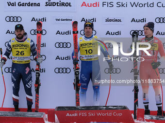 (From left to right) Jared Goldberg of Team United States in second place, Mattia Casse of Team Italy in first place, and Marco Odermatt of...