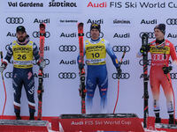 (From left to right) Jared Goldberg of Team United States in second place, Mattia Casse of Team Italy in first place, and Marco Odermatt of...