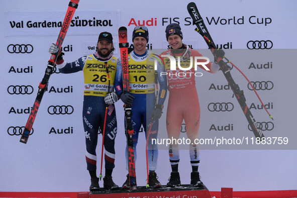 (From left to right) Jared Goldberg of Team United States in second place, Mattia Casse of Team Italy in first place, and Marco Odermatt of...